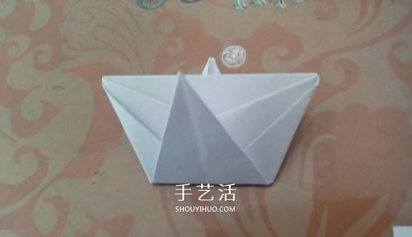 最簡單元寶的疊法圖解 怎么折紙?jiān)獙毜姆椒?-  itrip.net.cn